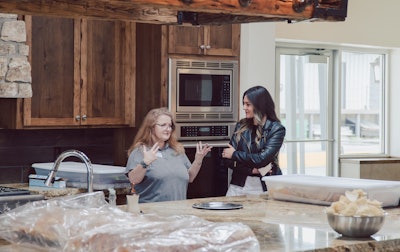 Stroup prepares a meal in the Legacy Lodge.