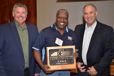 YRC Freight driver Alphonso Lewis, center, won first class in Alabama's 5-axle class. (Image Courtesy of Alabama Trucking Association/Facebook)