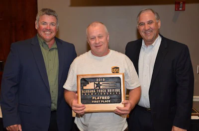 UPS Freight driver Rodney Cosper, center, won first place in the flatbed class. (Image Courtesy of Alabama Trucking Association/Facebook)