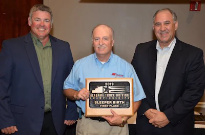 AAA Cooper Transportation driver Gary Nuckholls, center, won first place in Alabama's sleeper berth class. (Image Courtesy of Alabama Trucking Association/Facebook)