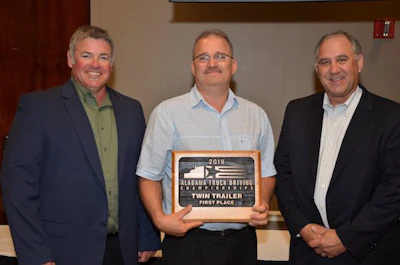 AAA Cooper Transportation driver Mark Knight, center, won first place in Alabama's twins class. (Image Courtesy of Alabama Trucking Association/Facebook)