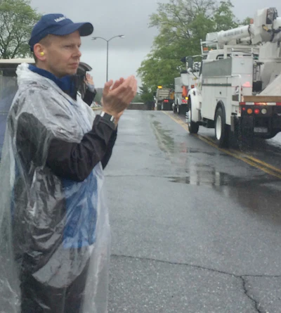 Make-A-Wish Regional Director Benn Lee cheers on trucks in the rain at this year’s Mother’s day Convoy in Lancaster, Pennsylvania