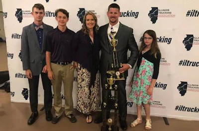 FedEx driver Ritch Fundell celebrates his grand champion win with his family. (Image Courtesy of Illinois Trucking Association)