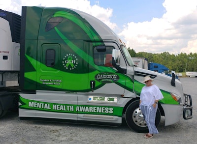 Truck driver Lucy Fulsom drives this wrapped truck for R.E. Garrison. (Image Courtesy of Lucy Fulsom)