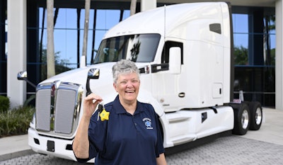 Owner-operator Cecilia Logan stands in front of her new Kenworth. (Image Courtesy of Landstar System)