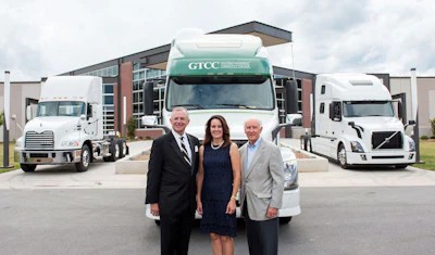 GTCC has acquired three trucks for its new CDL program. Pictured from left to right: GTCC President Randy Parker, former GTCC BOT Chair Susan Alt, and TranSource Treasurer Jim Bland. (Image Courtesy of GTCC)