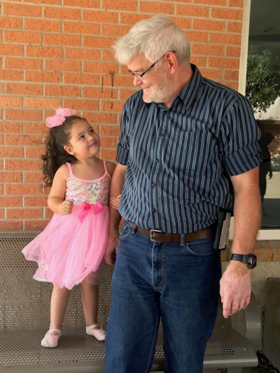 Terry Pratt and Stan Davis’ daughter stand together for a photo.