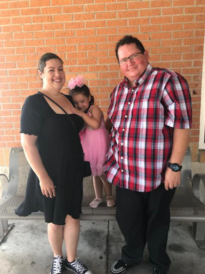Stan Davis and his wife, Ellen, with their daughter.