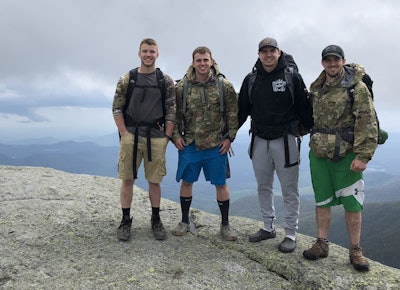 Bradley Chislett, center right, spends his time outdoors when he isn’t trucking.