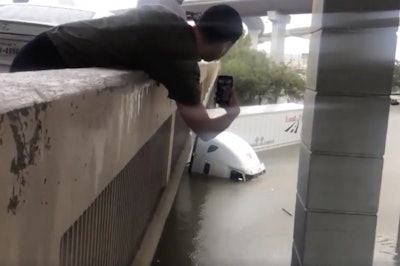 The driver of this tractor-trailer had to be rescued after driving into flood waters in Texas.