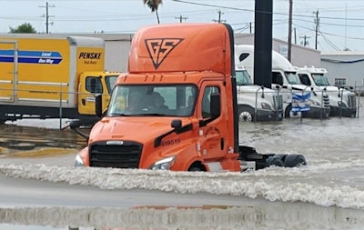 A truck plows through flood waters in Texas