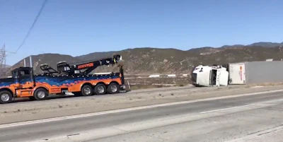 Santa Ana winds toppled trucks in California