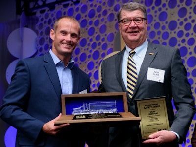 Rich Clair Solar Transport president (right) and Corey Lias from Great West Casualty Company.