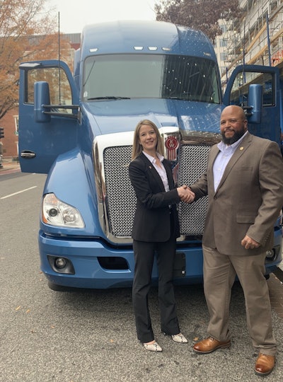 Lisa Berreth, Kenworth’s marketing director, congratulates Joseph Campbell on his win.
