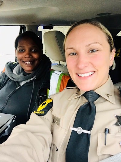 Trooper Clausing of the Illinois State Police and Malinda, a trucker she helped