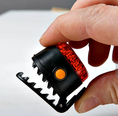 Small LED clips on to clothing for added visibility