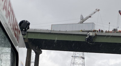 tractor-trailer-hangs-off-bridge