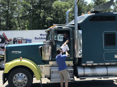 Truckers were handed food by Randall-Reilly and Chick-Fil-A employees as they drove through the rest area