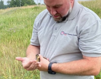 Bradley XXXX and one of the ducklings he rescued in New Hampshire. (NH State Police photos)
