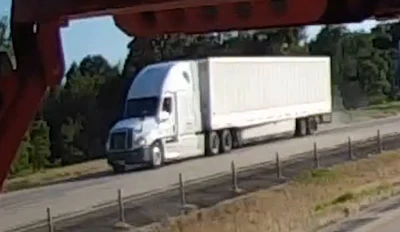 A traffic camera captured a photo of the tractor-trailer being sought connection with p[police are calling a hit-and-run accident.