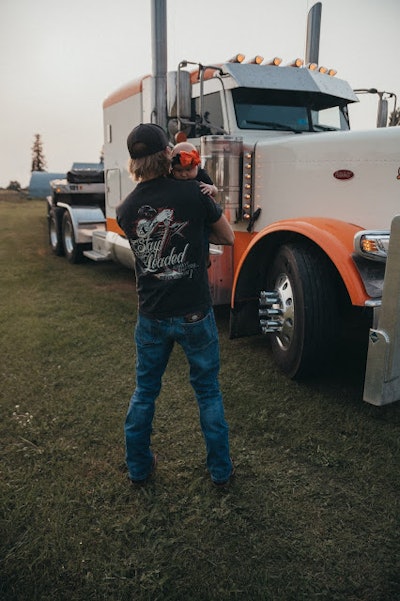 Jake Shellum holding 3-month-old daughter Chevelle (Photo byLeah LC Chennaux-Shellum)