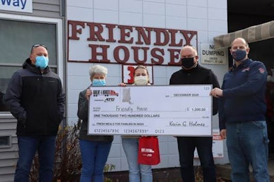 ATG employees are pictured above in front of Friendly House, one of the organizations that ATG supported