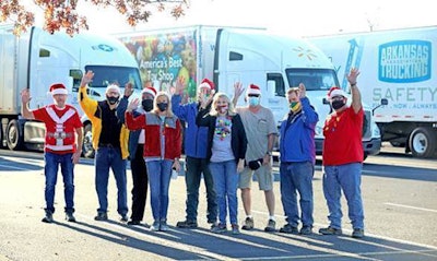 Arkansas Trucking Association members pictured above while volunteering for the Candyland Christmas event