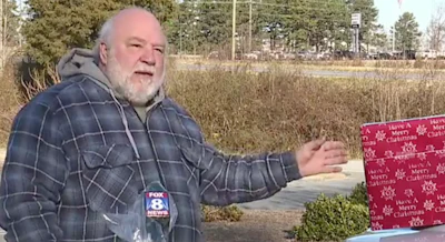 Scott Gill and the Christmas gift he found in the road