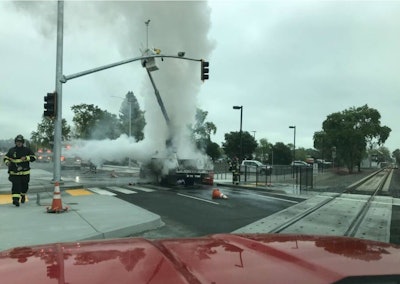 This photo by the Sonoma County Fire District shows the bucket truck with its worker stranded aloft.