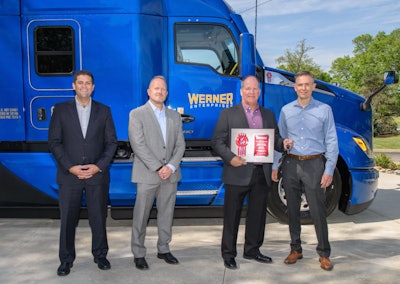 At far right, Kevin Baney, Kenworth general manager and PACCAR vice president, presents the keys – and a plaque signifying the delivery of the first production T680 Next Gen – to Scott Reed, Werner Enterprises senior vice president of equipment purchasing and maintenance. From far left are Corey Murphy, vice president of MHC Kenworth Iowa/Nebraska/Illinois, representing selling dealer MHC Kenworth – Omaha; and Tony Wahl, Werner Enterprises director of equipment purchasing.
