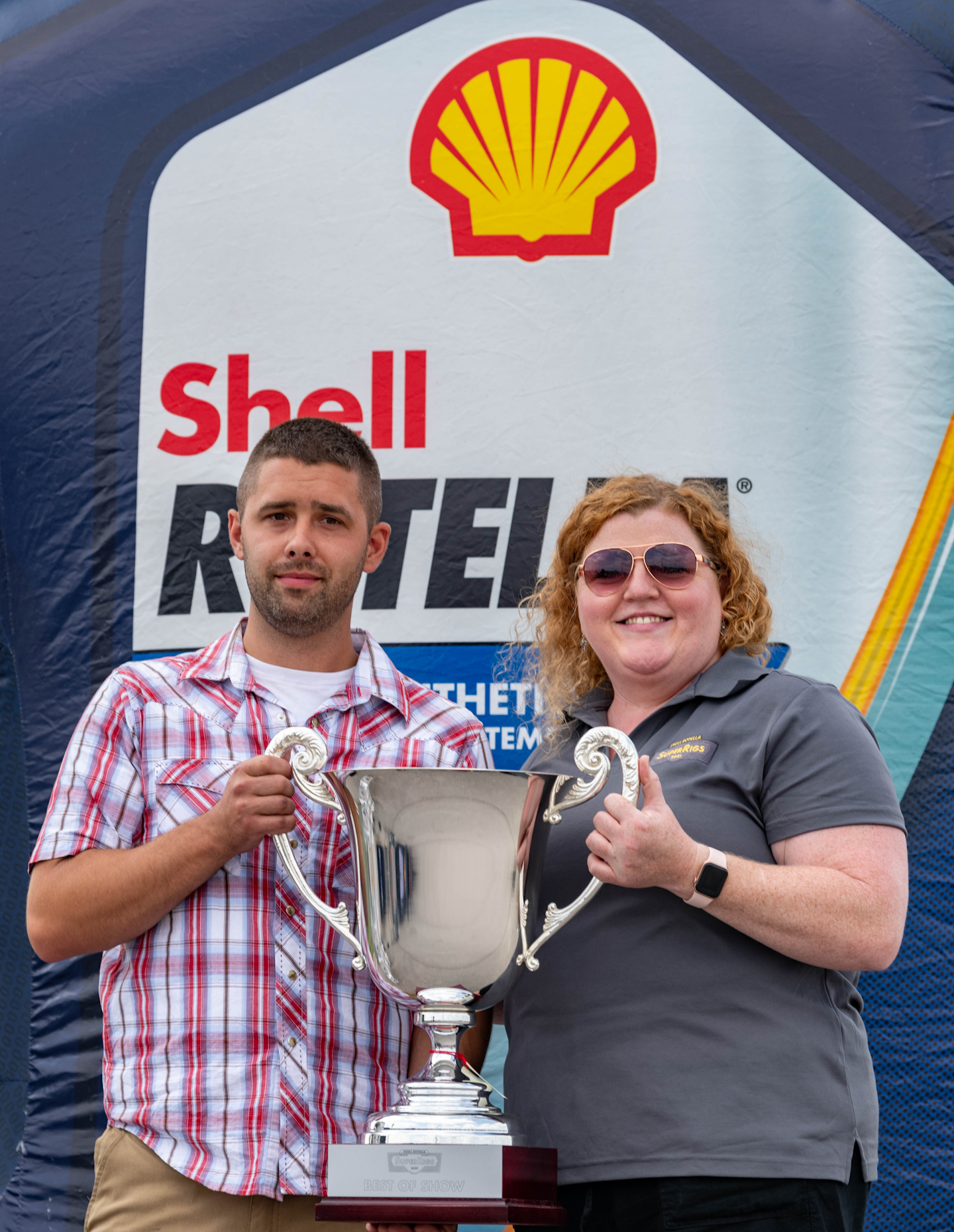 Kiegen Nelson accepts his Best of Show trophy from Heather Wales, North American Brand and Communications Manager, Shell Rotella.