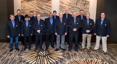 Members of the combined 2020 and 2021 Penske Logistics Driver Wall of Fame inductees include: Front row from left: Saturnino Garcia, Zeke Carmona, Roland Simpson, Joe Kilgo, Ron Hayduke, Rick Kiper, Richard Mulherin and Shawn Daly. Second row: Gabe Gurrola, Randy Jezewski, Robert Morgan, Chris Secord, Mark Willoughby, Donald Reinert, Greg Sabo and Mike Ebenhoeh. Not pictured: Perry Bastian, Kevin Baty, Jeffrey Farley, David Hertzberg, Robert Morris and James Reda