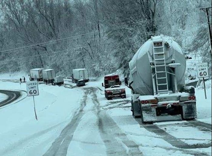 The Virginia State Police posted to Facebook: 'This was the scene this AM in the community of Lovingston in Nelson County, where VSP troopers, area wreckers, Virginia Department of Transportation crews & Nelson County Sheriff's Office worked for several hours to free more than a dozen stuck/disabled tractor-trailers in the northbound lanes of Route 29. The snow's quick, heavy downfall made this stretch of Route 29 treacherous and impassable for all drivers. Passenger & commercial vehicles are still advised to avoid using Route 29 through Nelson County until weather and road conditions improve.'