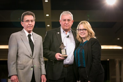 Bobby Berkstresser (center) passed away April 14 at the age of 71. He previously owned the White's Travel Center and Lee Hi Travel Plaza along I-81 in Virginia. He's shown here in 2018 receiving an award from NATSO's Lisa Mullings (right) and Coffee Cup Fuel Stops' Tom Heinz.