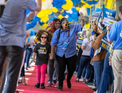 J.B. Hunt Dedicated driver Edwina and her family participate in the Million Mile Walk of Fame at corporate headquarters in Lowell. She is the first female driver to achieve three million safe miles in company history.