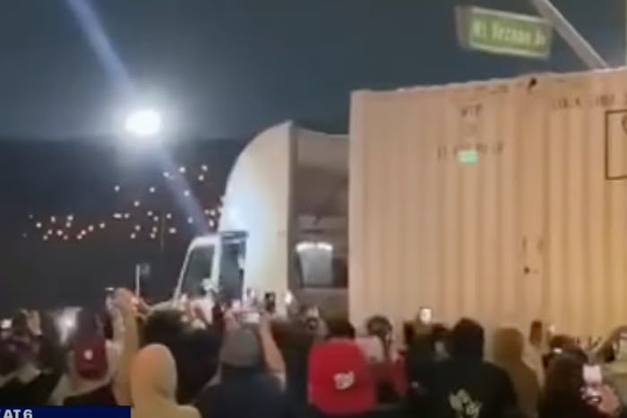 Trucker being attacked by a street takeover mob in California.