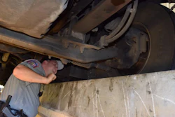 Inspector under truck