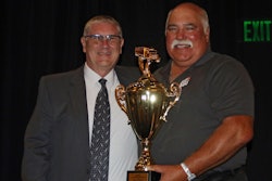 Two men with trophy