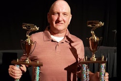 Man with trophies
