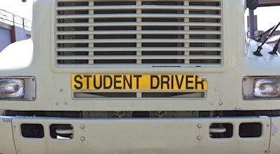 truck with student driver sign