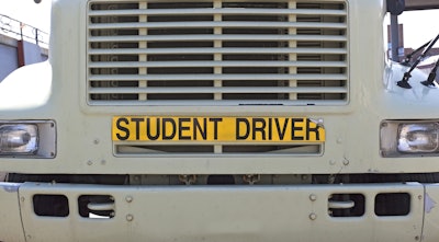 truck with student driver sign