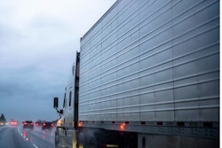 Tractor-trailer on highway in rain