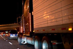 Tractor-trailer on highway at night