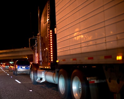 Tractor-trailer on highway at night