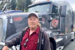 Truck driver with his tractor-trailer