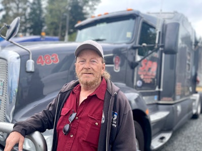 Truck driver with his tractor-trailer