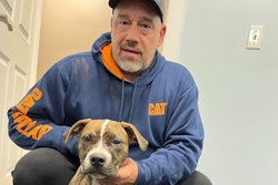 Truck driver with rescued dog
