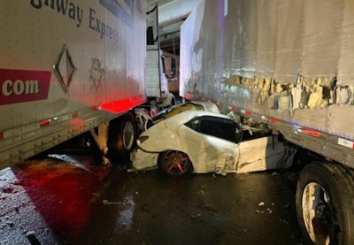 Car crushed between 2 tractor-trailers