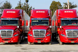 Three red trucks
