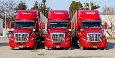 Three red trucks